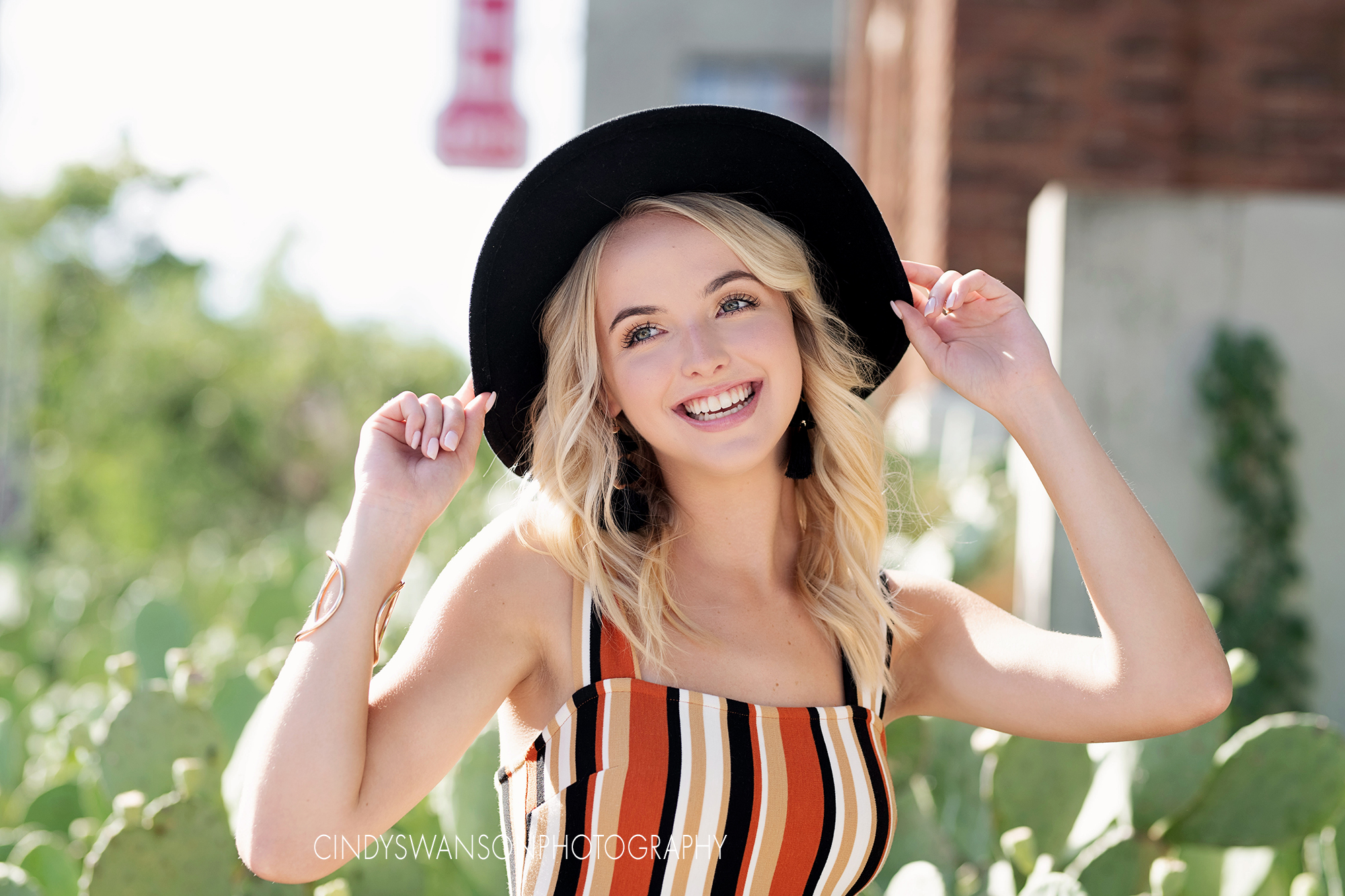 senior portraits with cactus  in deep ellum
